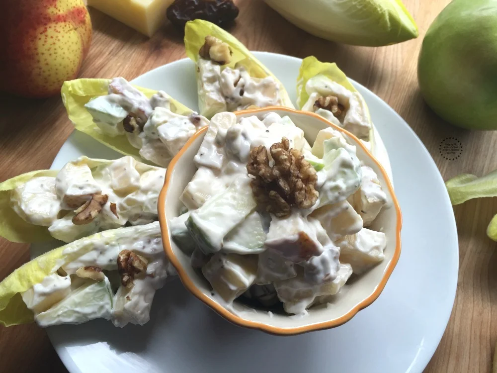 https://www.adrianasbestrecipes.com/wp-content/uploads/2016/12/Perfect-balance-of-sweet-creamy-and-savory-is-this-endive-apple-salad-with-walnuts-.jpg.webp