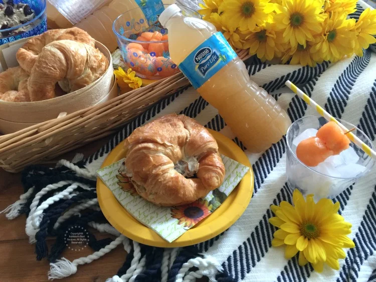 Pairing the lemon basil cantaloupe agua fresca with an almond cherry chicken salad croissant and fresh fruit