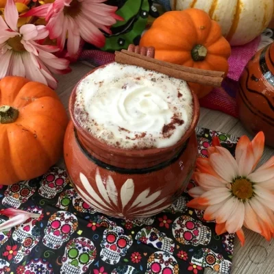 a jarrito served with coffee and topped with whipped cream