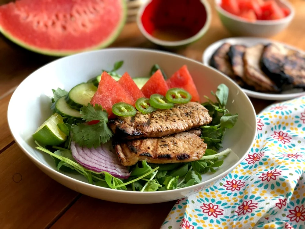 https://www.adrianasbestrecipes.com/wp-content/uploads/2018/07/A-Tasty-grilled-pork-chops-watermelon-salad-for-the-summer.jpg.webp