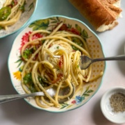 A fork with bacon perciatelli pasta