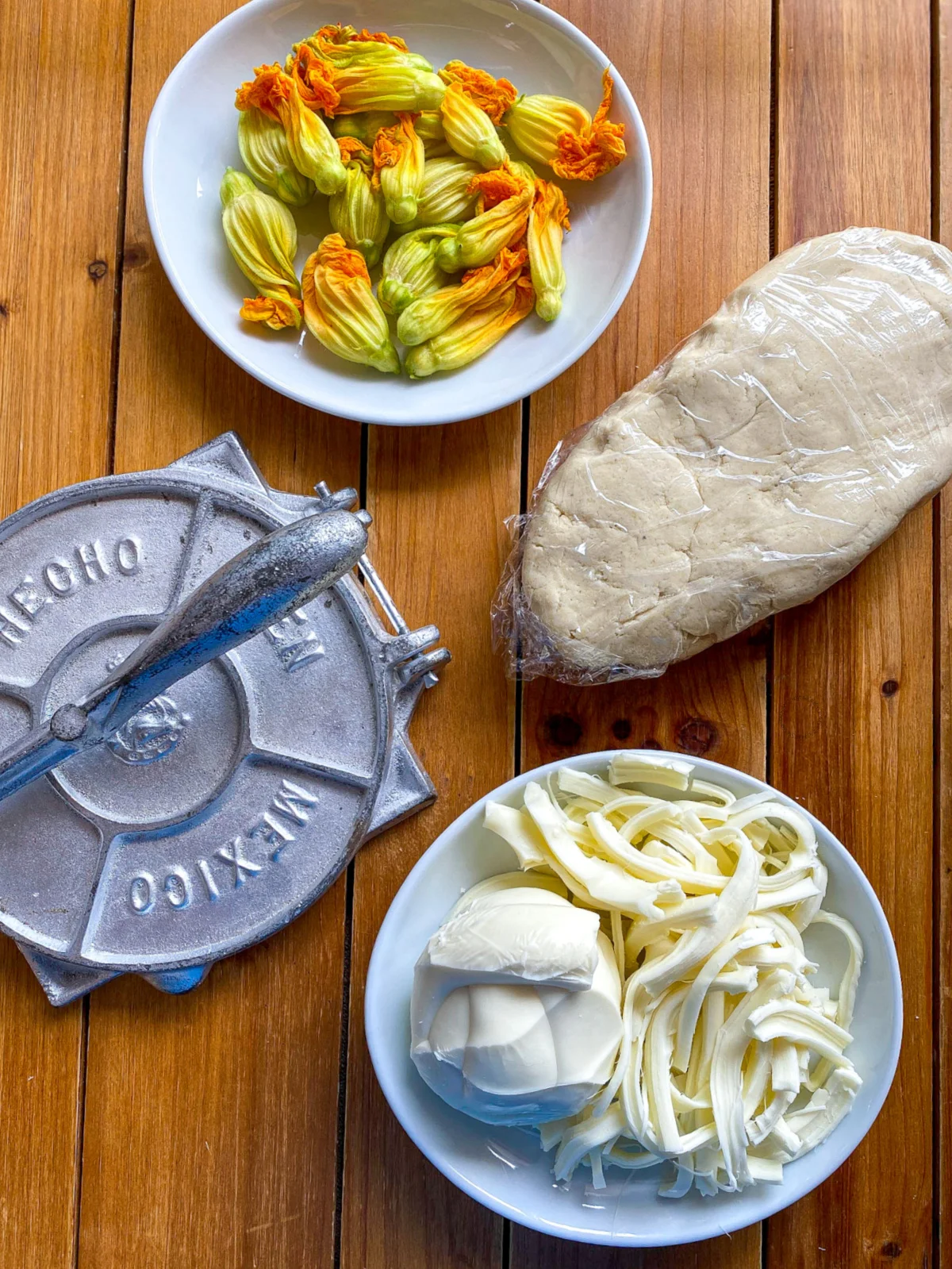 a tortilla maker and queso oaxaca